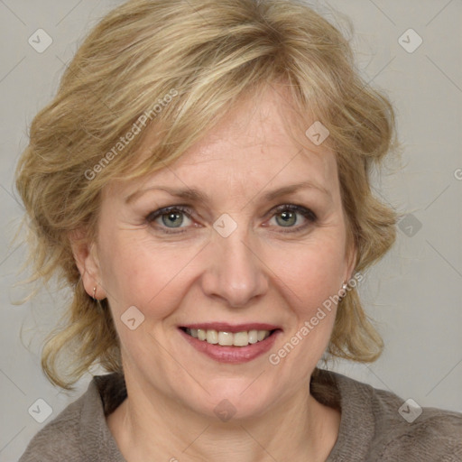 Joyful white adult female with medium  brown hair and blue eyes