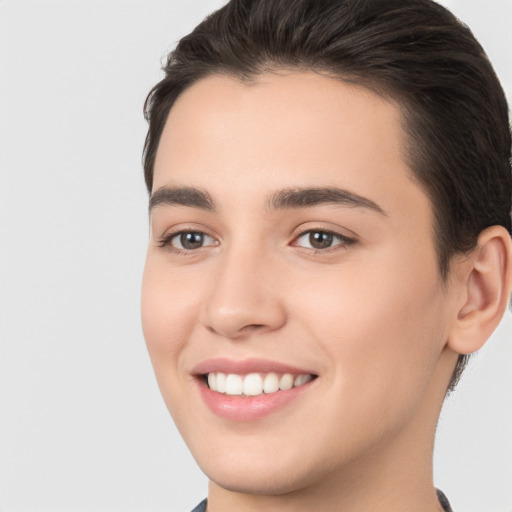 Joyful white young-adult female with short  brown hair and brown eyes