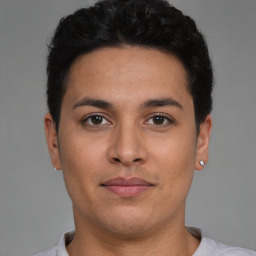 Neutral latino young-adult male with short  black hair and brown eyes