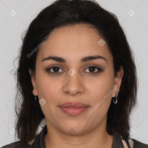 Joyful latino young-adult female with long  brown hair and brown eyes