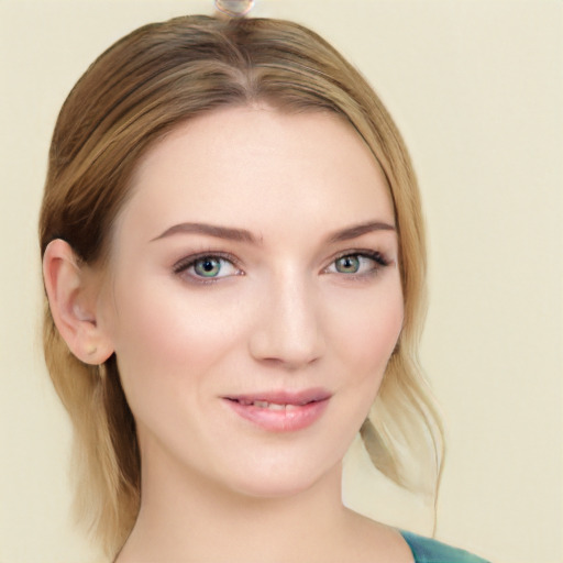 Joyful white young-adult female with medium  brown hair and blue eyes