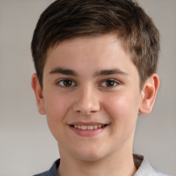 Joyful white child male with short  brown hair and brown eyes