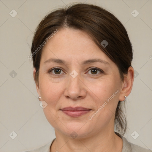 Joyful white adult female with medium  brown hair and grey eyes