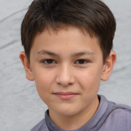 Joyful white child male with short  brown hair and brown eyes