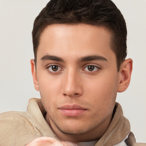 Neutral white young-adult male with short  brown hair and brown eyes