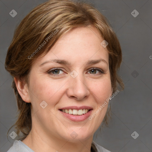 Joyful white adult female with medium  brown hair and blue eyes