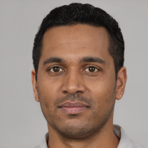 Neutral black young-adult male with short  black hair and brown eyes