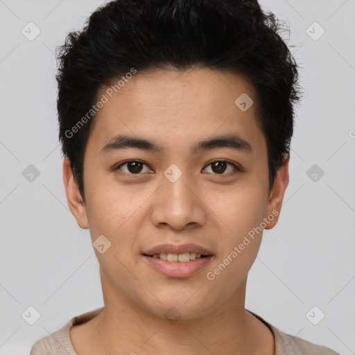 Joyful asian young-adult male with short  black hair and brown eyes