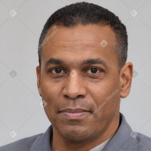 Neutral latino adult male with short  black hair and brown eyes