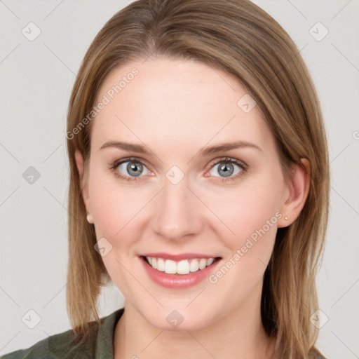 Joyful white young-adult female with medium  brown hair and grey eyes