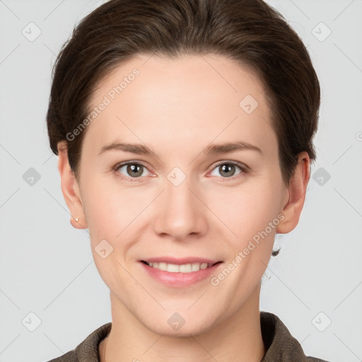 Joyful white young-adult female with short  brown hair and grey eyes