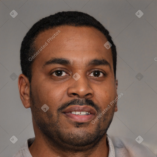 Joyful latino young-adult male with short  brown hair and brown eyes