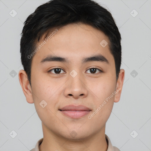 Joyful asian young-adult male with short  brown hair and brown eyes