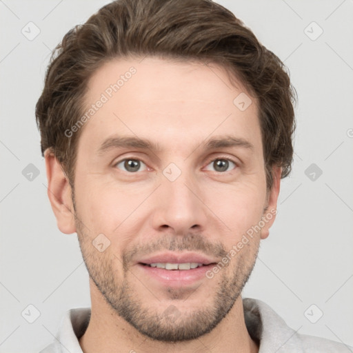 Joyful white adult male with short  brown hair and grey eyes