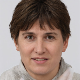 Joyful white adult female with short  brown hair and brown eyes