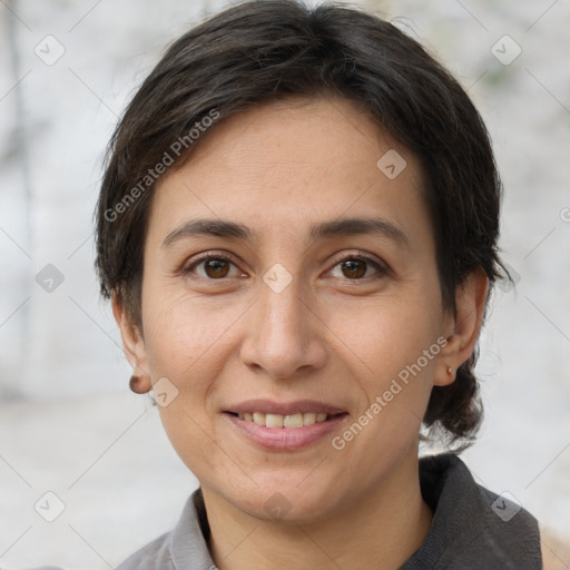 Joyful white adult female with short  brown hair and brown eyes