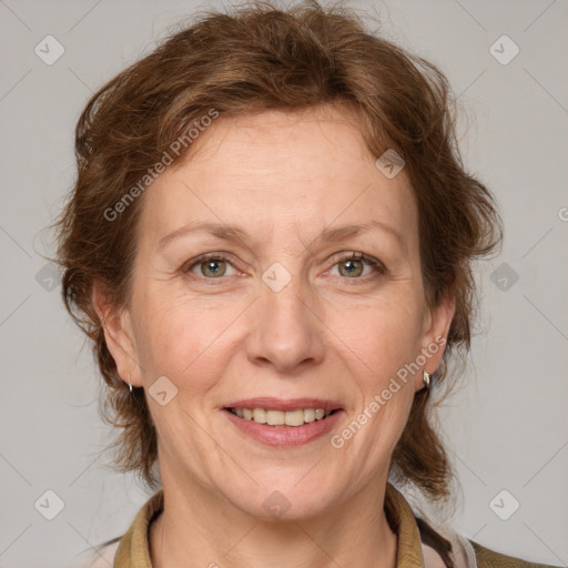 Joyful white adult female with medium  brown hair and grey eyes