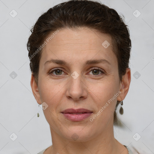 Joyful white adult female with short  brown hair and grey eyes