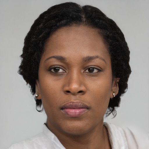 Neutral black young-adult female with short  black hair and brown eyes