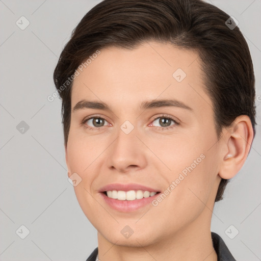 Joyful white young-adult female with short  brown hair and brown eyes