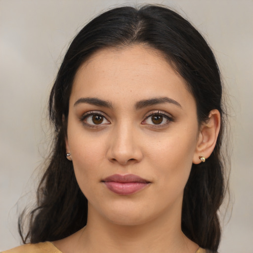 Joyful latino young-adult female with medium  brown hair and brown eyes