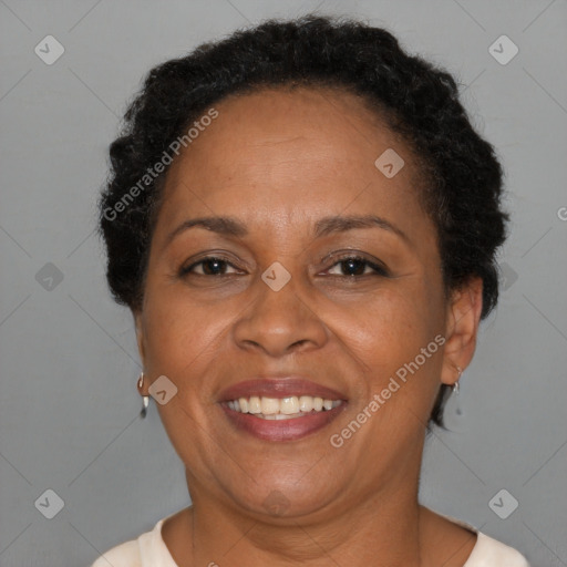 Joyful black adult female with short  brown hair and brown eyes