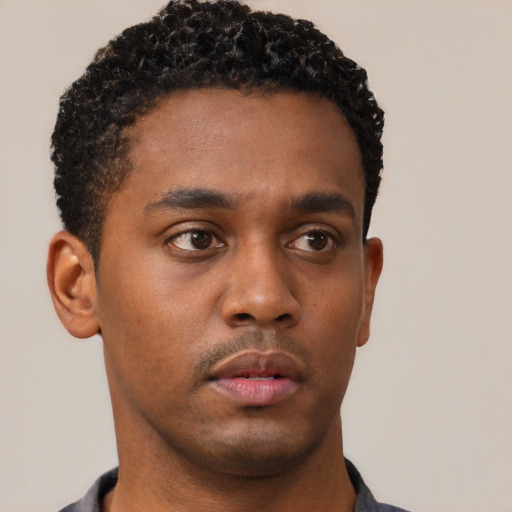 Neutral black young-adult male with short  brown hair and brown eyes