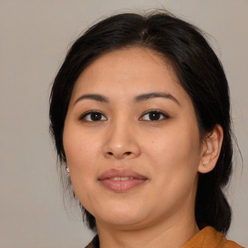Joyful asian young-adult female with medium  brown hair and brown eyes