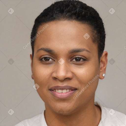 Joyful black young-adult female with short  black hair and brown eyes