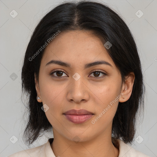 Joyful latino young-adult female with medium  brown hair and brown eyes