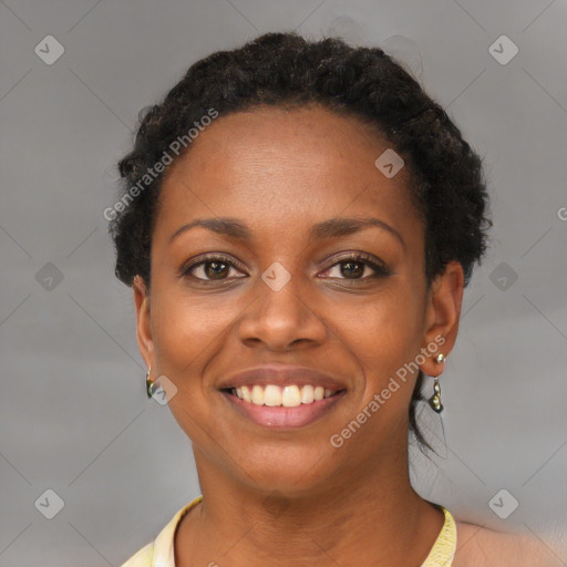 Joyful black young-adult female with short  brown hair and brown eyes