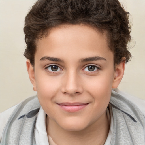 Joyful white child male with short  brown hair and brown eyes