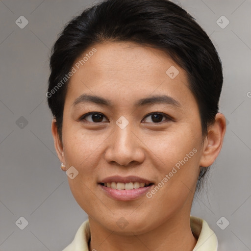 Joyful asian young-adult female with short  brown hair and brown eyes