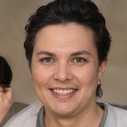 Joyful white adult female with short  brown hair and brown eyes