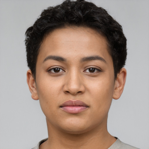 Joyful latino young-adult female with short  brown hair and brown eyes