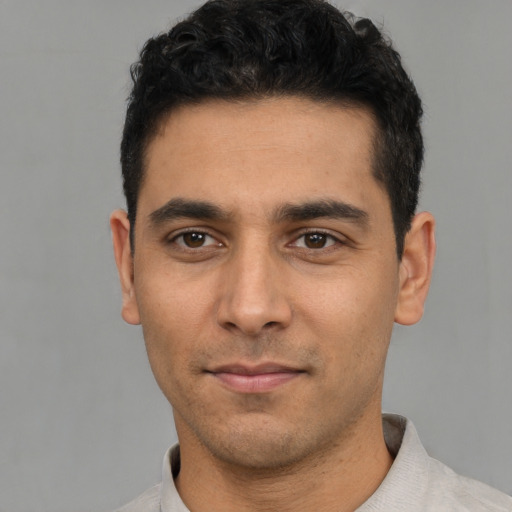 Neutral white young-adult male with short  black hair and brown eyes