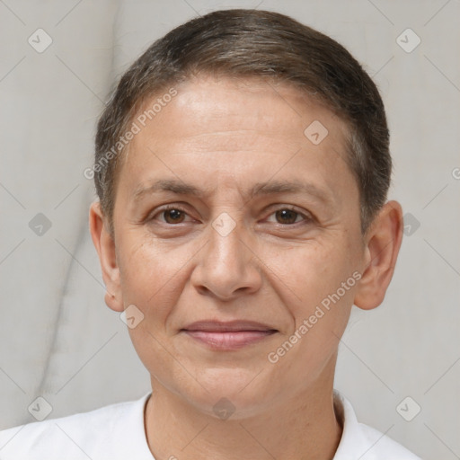 Joyful white adult female with short  brown hair and brown eyes