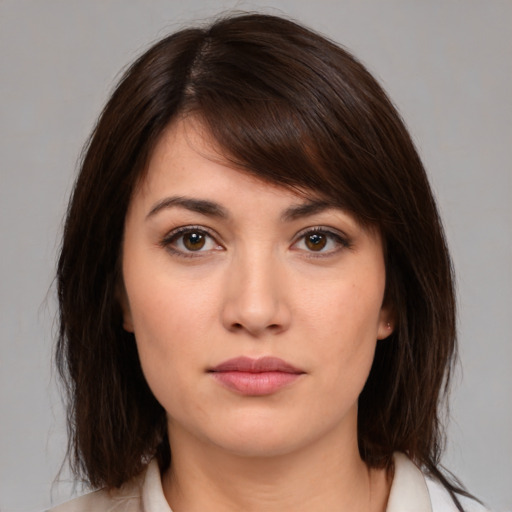 Neutral white young-adult female with medium  brown hair and brown eyes