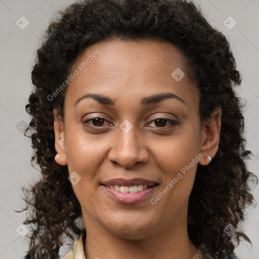 Joyful black young-adult female with long  brown hair and brown eyes