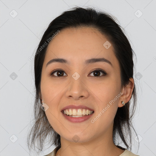 Joyful latino young-adult female with medium  brown hair and brown eyes