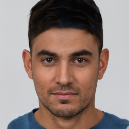 Neutral white young-adult male with short  black hair and brown eyes