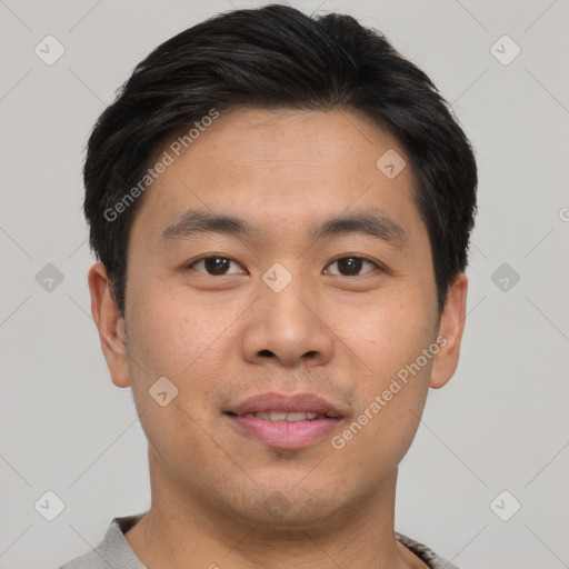 Joyful asian young-adult male with short  brown hair and brown eyes