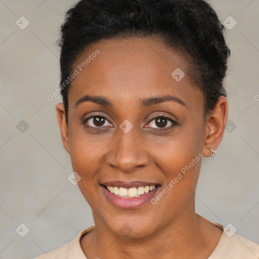 Joyful black young-adult female with short  brown hair and brown eyes