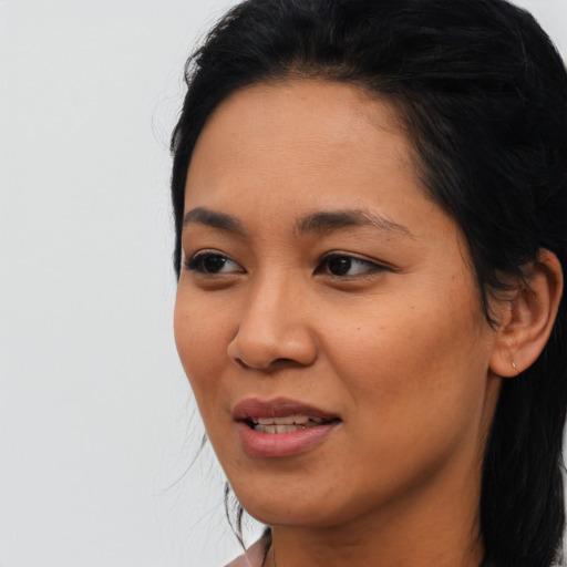 Joyful asian young-adult female with short  black hair and brown eyes