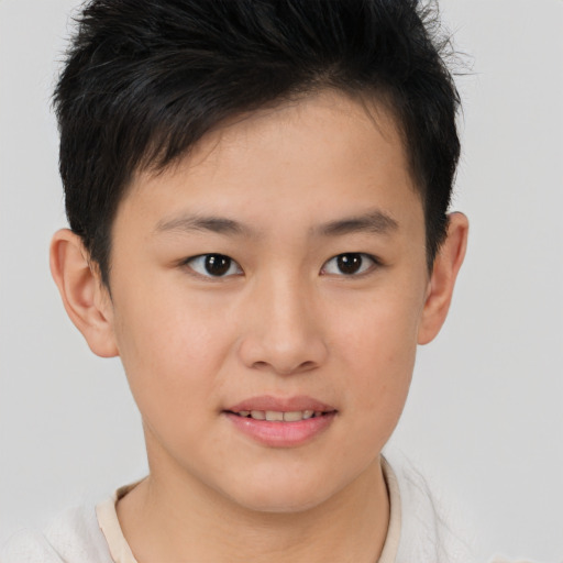 Joyful white child male with short  brown hair and brown eyes