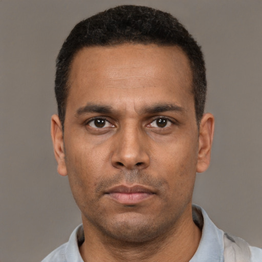 Neutral black young-adult male with short  black hair and brown eyes