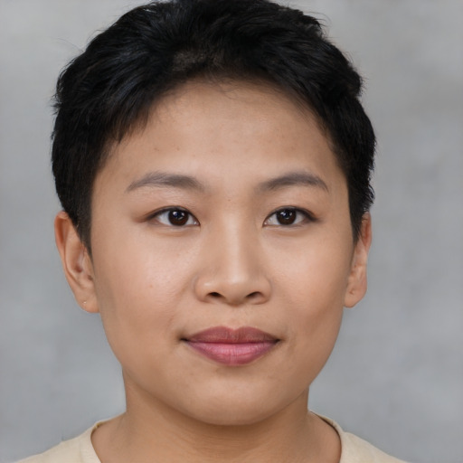 Joyful asian young-adult female with short  brown hair and brown eyes