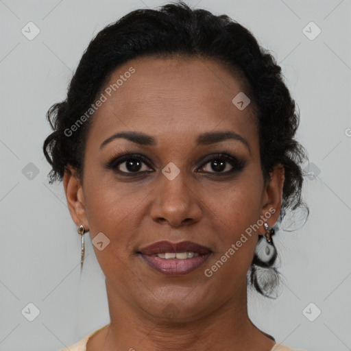 Joyful black adult female with short  brown hair and brown eyes