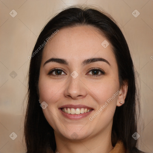 Joyful white young-adult female with long  brown hair and brown eyes