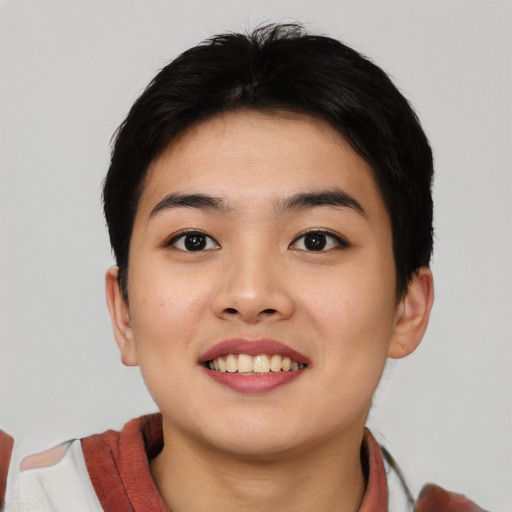 Joyful asian young-adult female with short  black hair and brown eyes